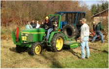 Student in FNR learning how to drive a tractor.